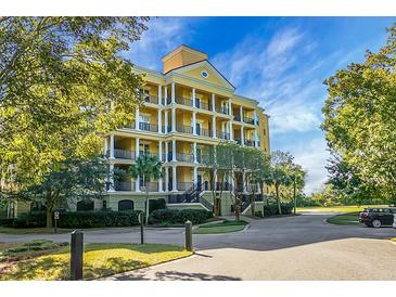 Luxury condo building with lush landscaping at 4252 Faber Place Dr # 203, North Charleston, SC 29405