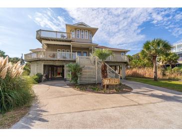 Two-story beach home with multiple decks and a spacious driveway at 202 Mary St, Edisto Island, SC 29438