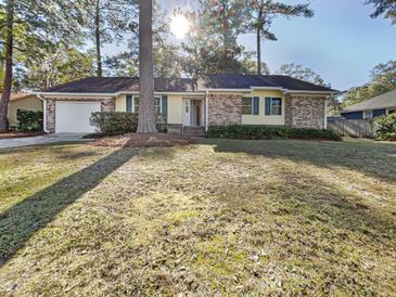 Brick ranch house with attached garage and landscaped yard at 108 Flicker Ln, Summerville, SC 29485