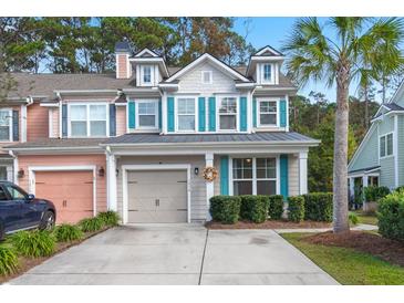 Two-story townhome with gray siding, teal shutters, and a metal roof at 1814 Chauncys Ct, Mount Pleasant, SC 29466