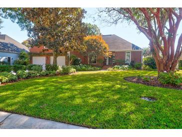 Brick home with 2-car garage and lush landscaping at 1272 Waterfront Dr, Mount Pleasant, SC 29464