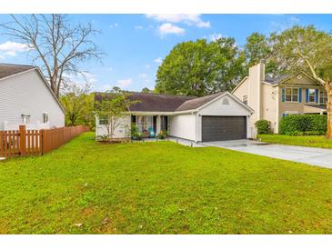 Charming single-story home with a spacious yard and attached garage at 325 Parish Parc Dr, Summerville, SC 29485