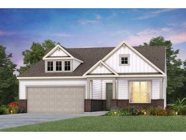 Two-story craftsman style home with a taupe garage door and brick accents at 646 Coral Bells Ln, Summerville, SC 29486