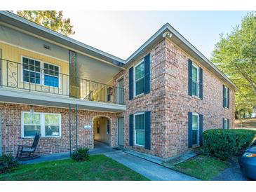 Brick building exterior with balconies and landscaping at 6240 Old Point Rd # C8, Hanahan, SC 29410