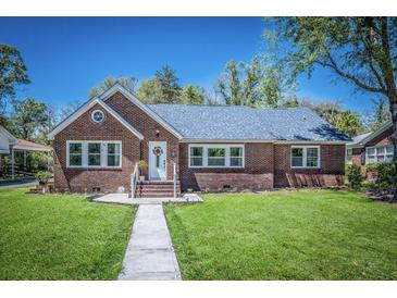 Brick home with gray roof, landscaped lawn, and walkway at 118 Carter, Walterboro, SC 29488
