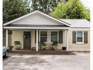 Charming renovated cottage with a welcoming front porch at 205 Scott St, Mount Pleasant, SC 29464