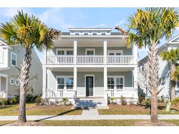 Two-story house with front porch and palm trees in the yard at 1820 Agate Bay Dr, Mount Pleasant, SC 29466