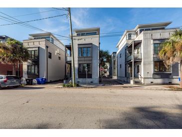 Three-story townhouses with street parking at 195 Saint Philip St, Charleston, SC 29403