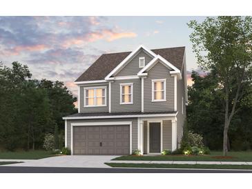 Two-story Craftsman style home with gray siding, brown roof, and a two-car garage at 4135 Collins Dr, Charleston, SC 29414