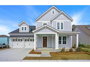 Two-story house with gray siding, white trim, and a three-car garage at 316 Trailmore Ln, Summerville, SC 29486