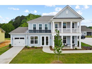 Two-story home with gray siding, white trim, and a front porch at 775 Maynard Ln, Summerville, SC 29486