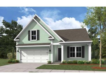 One-story house with light green siding, gray roof, and a two-car garage at 317 Abercom Place Dr, Moncks Corner, SC 29461