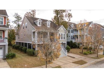 Two-story house with gray siding, white trim, and a front porch at 1944 Gracewood Dr, Charleston, SC 29414