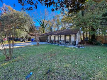 Charming ranch home with landscaped yard and attached garage at 2931 Newport Place Pl, North Charleston, SC 29420