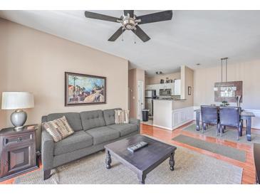 Open living area with comfortable seating, dining table, and view of the kitchen at 1600 Long Grove Dr # 914, Mount Pleasant, SC 29466