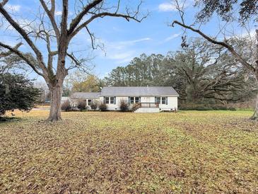 Ranch home with large yard and mature trees at 1613 Cavanaugh Rd, Walterboro, SC 29488