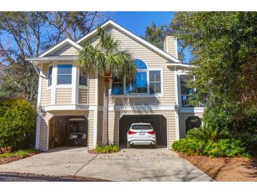 Charming two-story home with covered parking and lush landscaping at 1551 Ben Sawyer Blvd # 22, Mount Pleasant, SC 29464