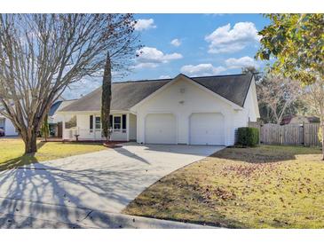 Charming single-story home with a two-car garage and a welcoming front porch at 3009 Woodington Pl, Goose Creek, SC 29445