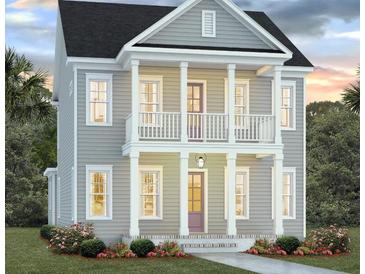 Charming two-story home with a front porch and balcony at 517 Rustling Tree Ct, Summerville, SC 29486