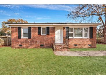 Charming brick home with a lush green lawn and updated windows at 442 Annette Dr, Goose Creek, SC 29445
