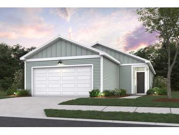 One-story home with light green siding, white garage door, and landscaping at 749 Meadowbrook Ln, Summerville, SC 29486