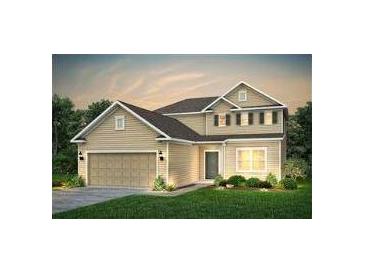Two story house with beige siding, brown roof, and a two car garage at 147 Royal Cainhoy Way, Huger, SC 29450
