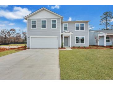 Two-story home with gray siding, white trim, and a two-car garage at 5007 Scow Ct, Summerville, SC 29485