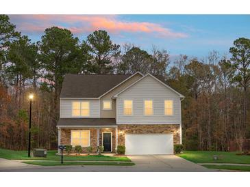 Two-story house with stone accents and a two-car garage at 261 Old Carolina Dr, Goose Creek, SC 29445