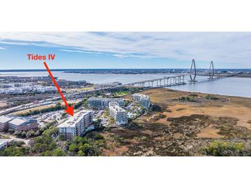 Aerial view of Tides IV, showcasing its location near a bridge and water at 155 Wingo Way # 424, Mount Pleasant, SC 29464