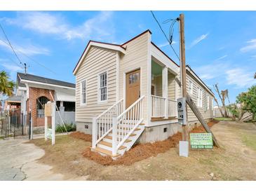 Newly renovated craftsman home featuring a welcoming front porch and charming facade at 194 Nassau St, Charleston, SC 29403