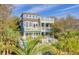 Two-story home with a pool and deck, offering luxury coastal living at 913 Carolina Blvd, Isle of Palms, SC 29451