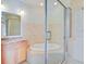Bathroom with a large soaking tub, shower, and granite vanity at 913 Carolina Blvd, Isle of Palms, SC 29451