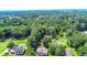 Aerial view of homes nestled in a wooded area, showcasing expansive green spaces at 1633 Rose Dr, Summerville, SC 29486
