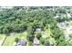 Aerial view of a house nestled in a lush, wooded area at 1633 Rose Dr, Summerville, SC 29486