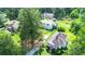 Aerial view of several houses and properties with mature trees at 1633 Rose Dr, Summerville, SC 29486