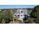Waterfront home boasts a charming exterior and lush landscaping at 268 Little Oak Island Dr, Folly Beach, SC 29439