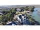Waterfront property showcasing a beautiful home and lush landscaping at 268 Little Oak Island Dr, Folly Beach, SC 29439