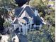 Large home with expansive roofline and white columns at 268 Little Oak Island Dr, Folly Beach, SC 29439