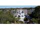 Beautiful waterfront home with palm trees and a white staircase at 268 Little Oak Island Dr, Folly Beach, SC 29439