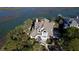 Luxury waterfront home with expansive roofline and private dock at 268 Little Oak Island Dr, Folly Beach, SC 29439
