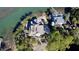 Luxury waterfront home with a copper roof and large windows at 268 Little Oak Island Dr, Folly Beach, SC 29439