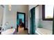 Bathroom with teal accents, bathtub and shower at 268 Little Oak Island Dr, Folly Beach, SC 29439
