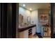 Double vanity bathroom with stone countertops and decorative mirrors at 268 Little Oak Island Dr, Folly Beach, SC 29439