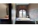 Bathroom with a large jacuzzi tub and a window at 268 Little Oak Island Dr, Folly Beach, SC 29439
