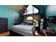 Bedroom with teal walls, large bed, and views at 268 Little Oak Island Dr, Folly Beach, SC 29439