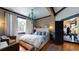Spacious bedroom with large bed, sitting area, and hardwood floors at 268 Little Oak Island Dr, Folly Beach, SC 29439