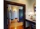 Bright hallway with hardwood floors and access to bedrooms at 268 Little Oak Island Dr, Folly Beach, SC 29439