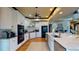 Modern kitchen with white cabinets, granite counters, and stainless steel appliances at 268 Little Oak Island Dr, Folly Beach, SC 29439