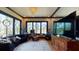 Living room with large TV, comfortable seating, and water views at 268 Little Oak Island Dr, Folly Beach, SC 29439