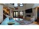 Spacious living room features a fireplace and access to a deck with water views at 268 Little Oak Island Dr, Folly Beach, SC 29439